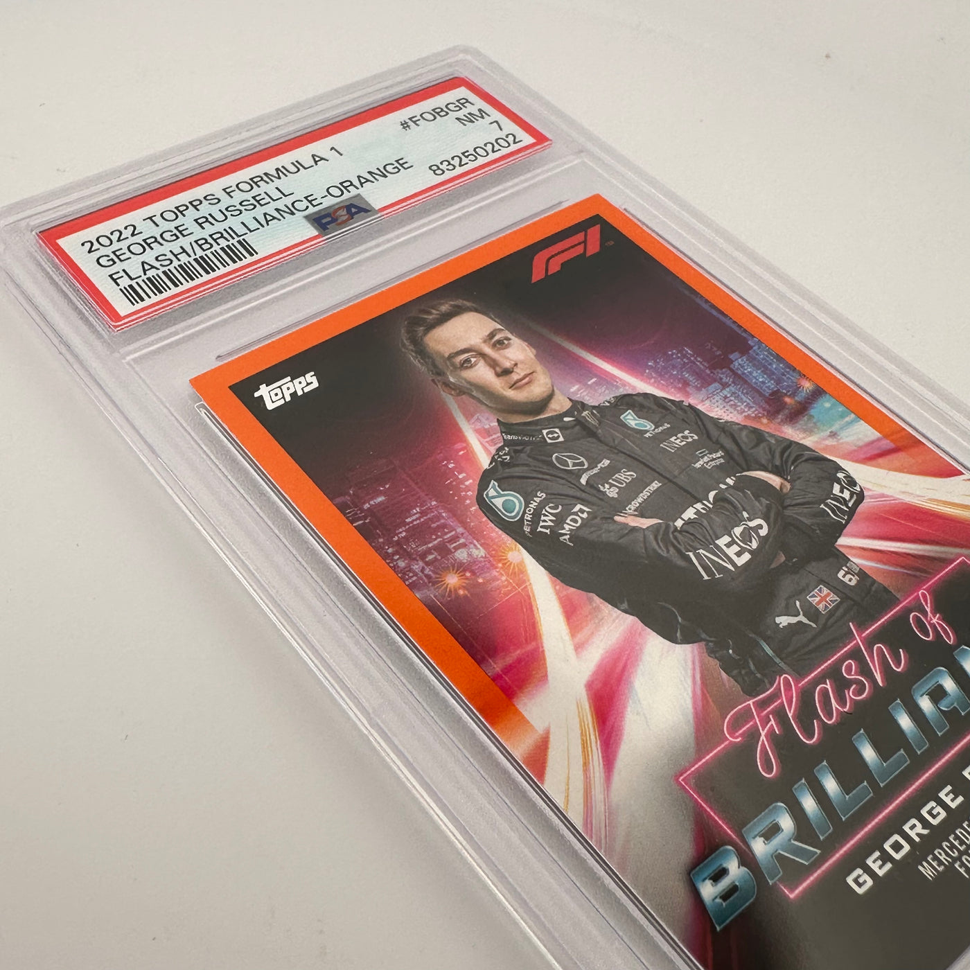 PSA 7 - 5/25 - George Russell #FOBGR - Flash Of Brilliance - Orange