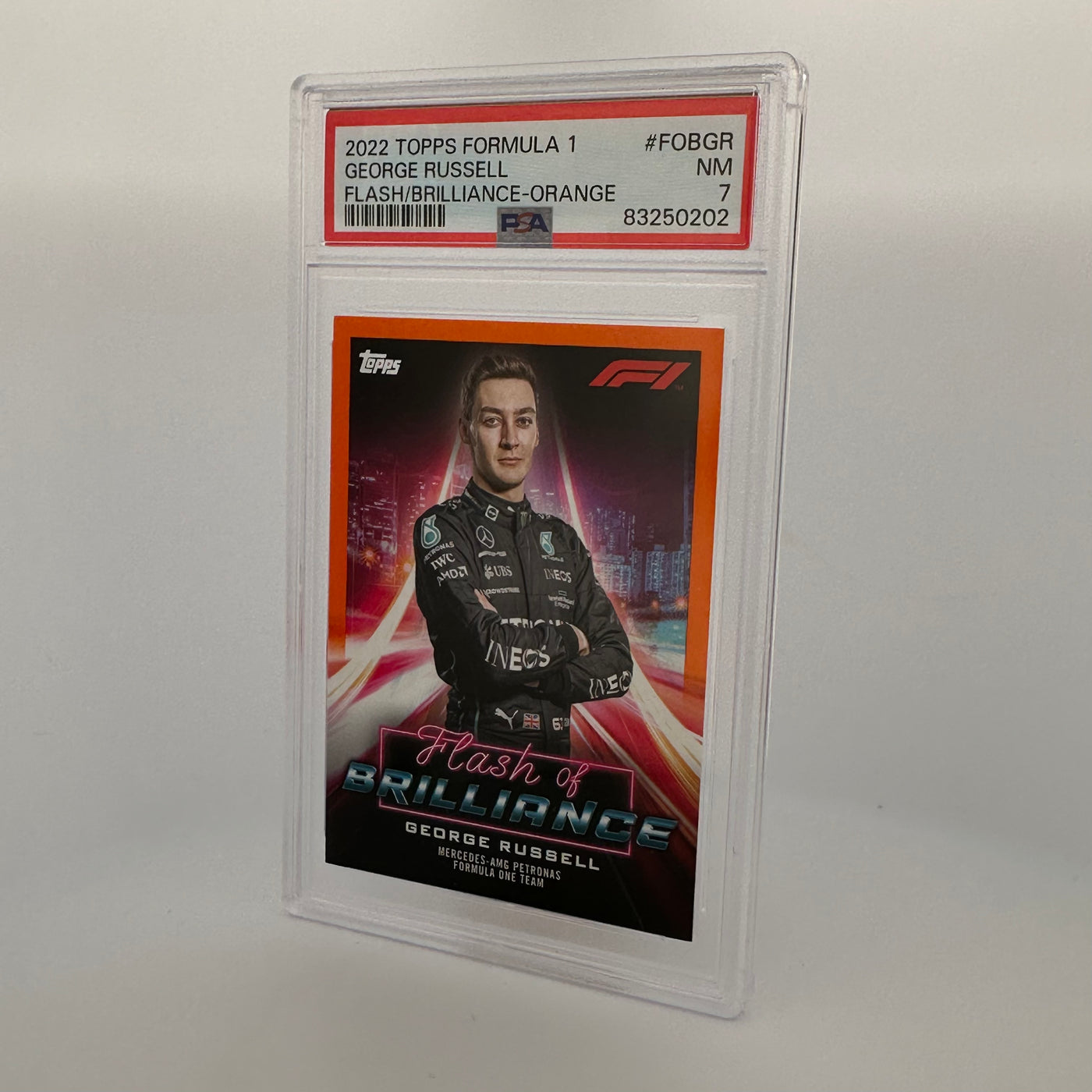 PSA 7 - 5/25 - George Russell #FOBGR - Flash Of Brilliance - Orange